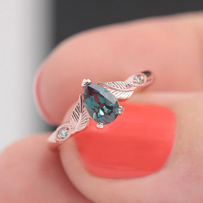 alexandrite pear shaped with diamonds in leaf engagement ring rose gold