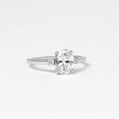 oval moissanite trilogy engagement ring white gold